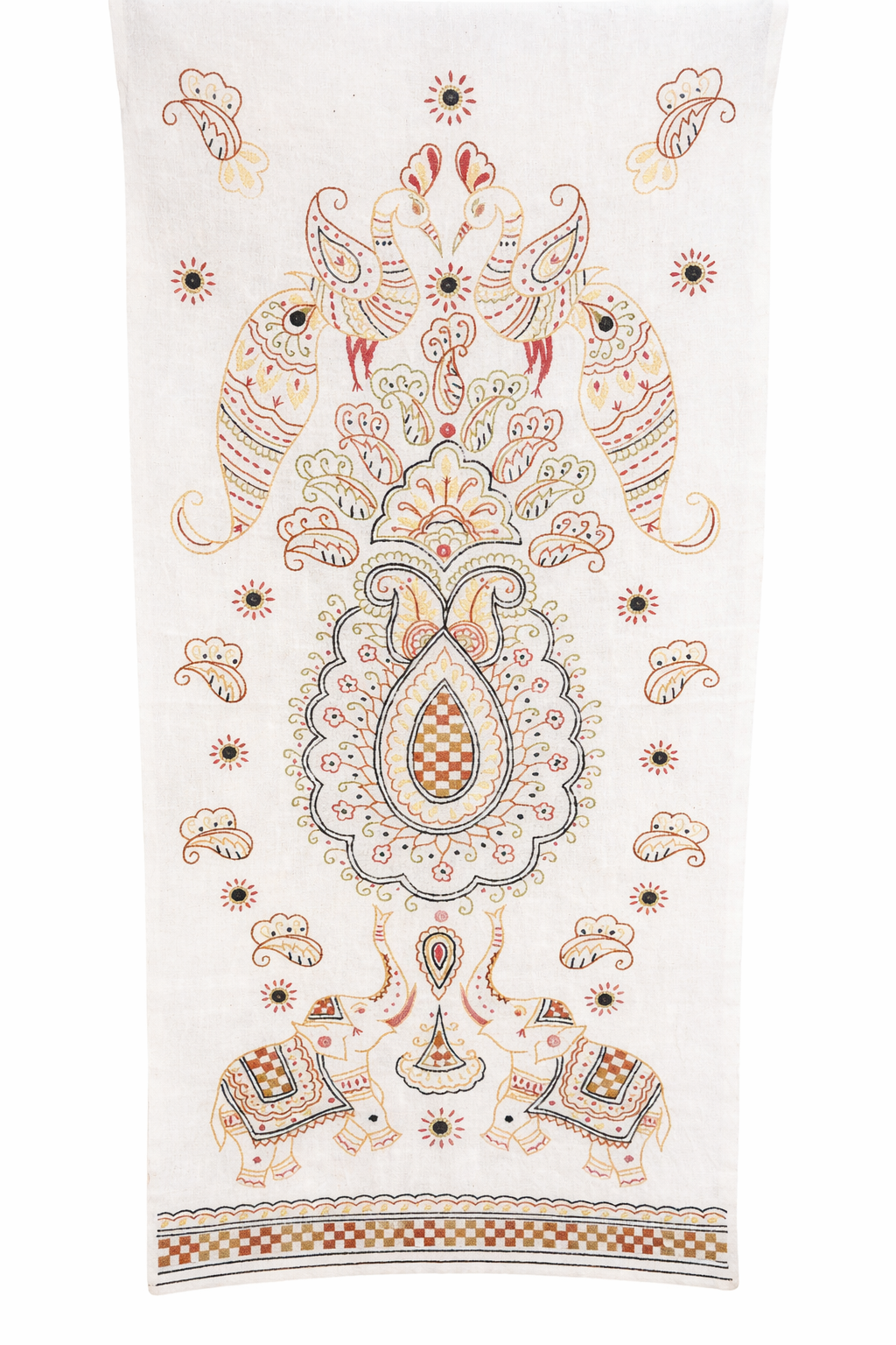 White fabric textile featuring a symmetrical folk-style embroidered design in warm tones of rust, mustard, and soft black. The central motif is a large paisley medallion surrounded by decorative florals and scrolling shapes. At the top, two stylised birds face each other, while at the bottom two small elephants face outward. Small floral dots and paisley accents are scattered throughout the design, with a patterned border along the lower edge.