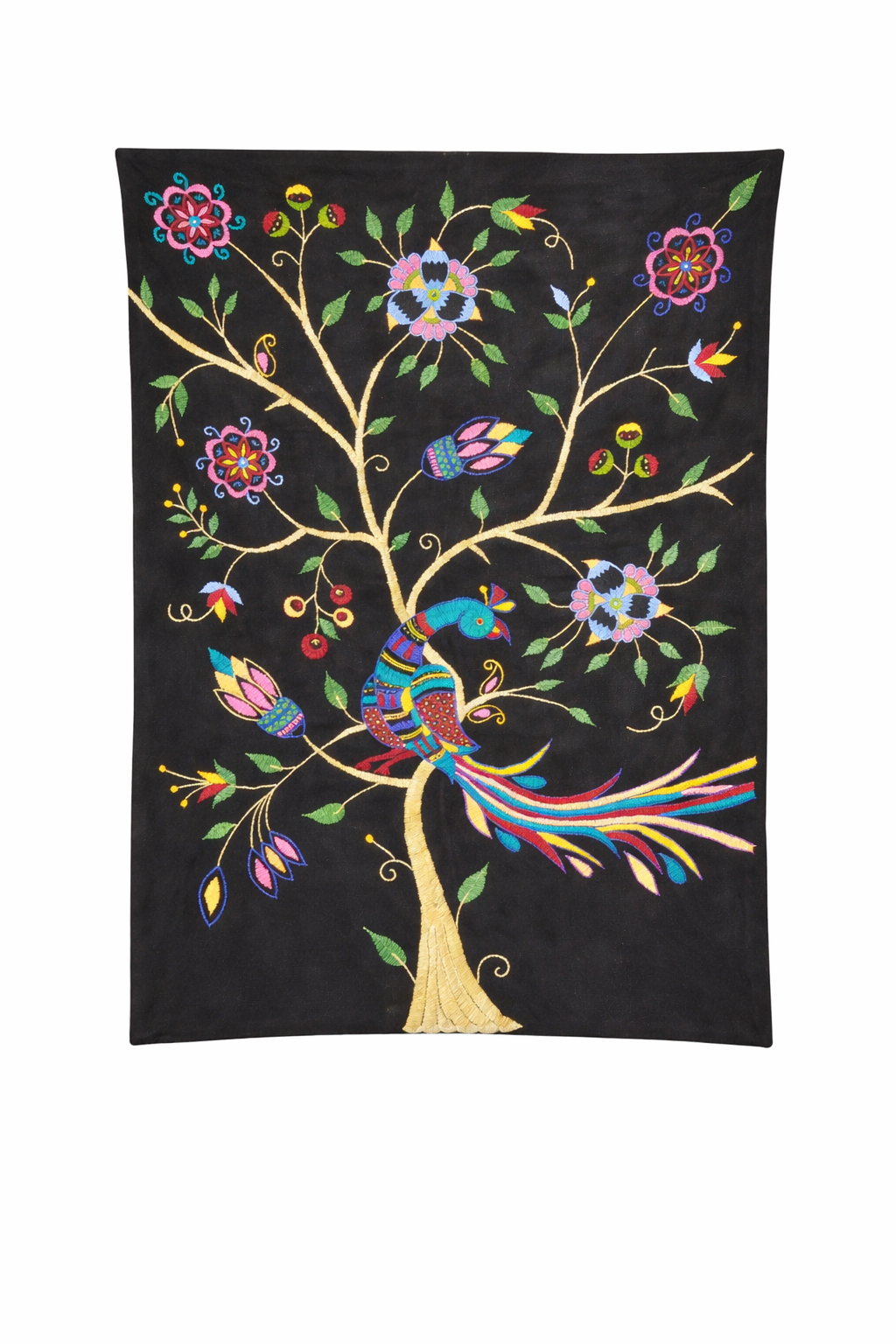 Black textile featuring a vibrant embroidered folk-art design of a stylised tree with curling branches, colourful flowers, and leaves. A decorative peacock with a long flowing tail in bright shades of blue, red, yellow, and turquoise perches on one of the branches, surrounded by detailed floral motifs and buds. The embroidery stands out vividly against the dark background, creating a striking and ornate decorative piece.